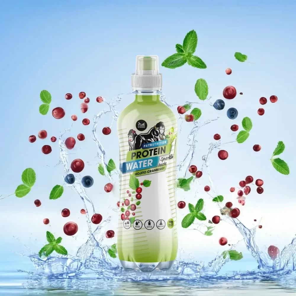 Light green bottle of sparkling mojito cranberry protein water with floating cranberries, blueberries, and mint leaves, surrounded by splashing water against a bright blue background for a crisp and refreshing look